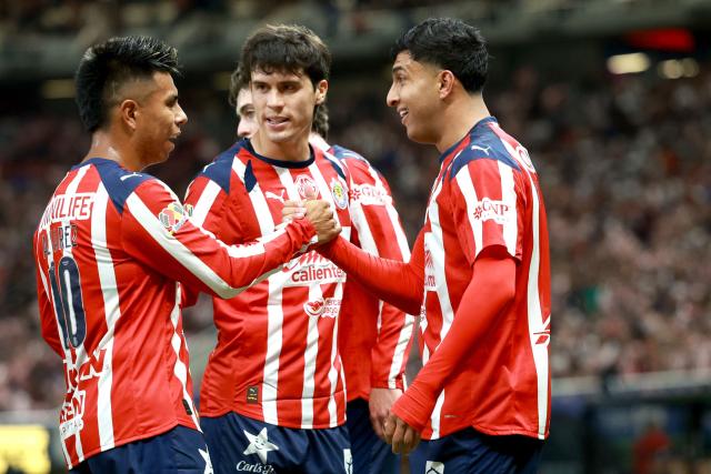 Guadalajara's defender #05 Bryan Gonzalez (R) celebrates with teammates after scoring his team's first goal during the Liga MX Clausura football match between Guadalajara and Puebla at Akron stadium in Zapopan, Jalisco state, Mexico on April 18, 2026. (Photo by ULISES RUIZ / AFP)