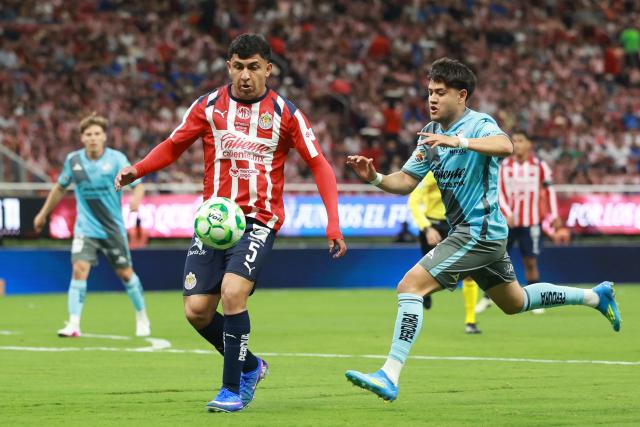 Guadalajara's defender #05 Bryan Gonzalez (L) and Puebla's midfielder #21 Owen Gonzalez (R) fight for the ball during the Liga MX Clausura football match between Guadalajara and Puebla at Akron stadium in Zapopan, Jalisco state, Mexico on April 18, 2026. (Photo by ULISES RUIZ / AFP)