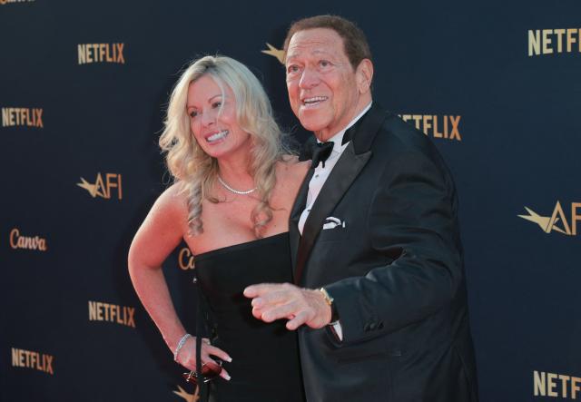 US comedian actor Joe Piscopo and guest attend the 2026 AFI Life Achievement Award at the Dolby Theatre in Hollywood, California on April 18, 2026. US actor Eddie Murphy is the recipient of the 2026 AFI Life Achievement Award. (Photo by Etienne LAURENT / AFP)