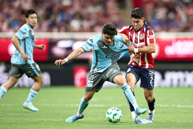 Puebla's midfielder #21 Owen Gonzalez and Guadalajara's defender #02 Jose Castillo fight for the ball during the Liga MX Clausura football match between Guadalajara and Puebla at Akron stadium in Zapopan, Jalisco state, Mexico on April 18, 2026. (Photo by Ulises Ruiz / AFP)