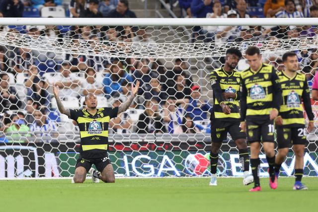 Pachuca's Brazilian forward #29 Kenedy celebrates scoring his team's first goal during the Liga MX Clausura football match between Monterrey and Pachuca at BBVA stadium in Guadalupe, Nuevo Leon state, Mexico on April 18, 2026. (Photo by Julio Cesar AGUILAR / AFP)