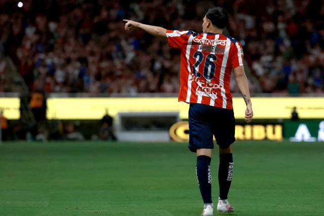 Guadalajara's forward #26 Hugo Camberos celebrates scoring his team's fifth goal during the Liga MX Clausura football match between Guadalajara and Puebla at Akron stadium in Zapopan, Jalisco state, Mexico on April 18, 2026. (Photo by ULISES RUIZ / AFP)