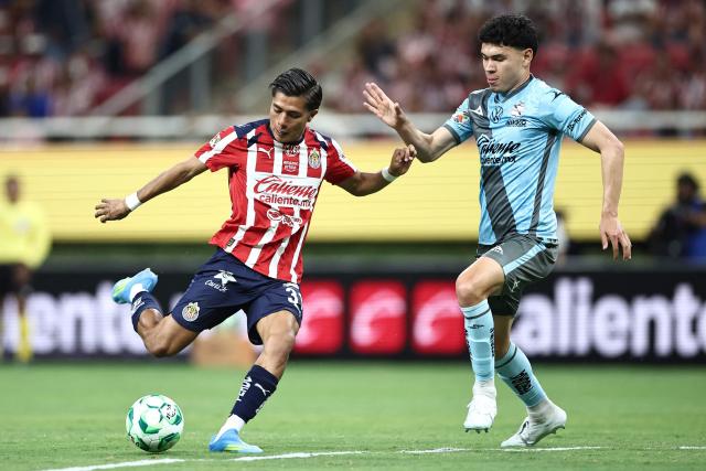 Guadalajara's defender #03 Gilberto Sepulveda (L) and Puebla's defender #03 Luis Rey (R) fight for the ball during the Liga MX Clausura football match between Guadalajara and Puebla at Akron stadium in Zapopan, Jalisco state, Mexico on April 18, 2026. (Photo by Ulises Ruiz / AFP)