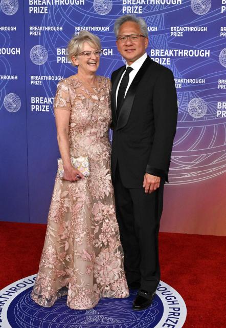 President and CEO of Nvidia Jensen Huang and his wife Lori Huang attend the 12th Breakthrough Prize Ceremony at Barker Hangar in Santa Monica, California on April 18, 2026. (Photo by LISA O'CONNOR / AFP)