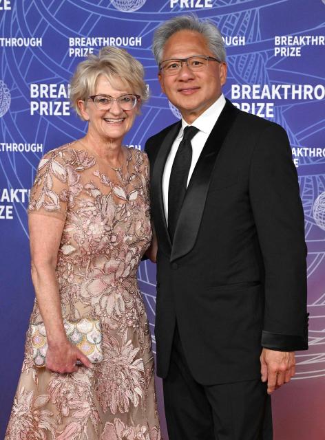 President and CEO of Nvidia Jensen Huang and his wife Lori Huang attend the 12th Breakthrough Prize Ceremony at Barker Hangar in Santa Monica, California on April 18, 2026. (Photo by LISA O'CONNOR / AFP)