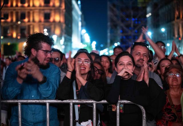 Spectators attend the Italian tenor classical musician Andrea Bocelli free concert at the Zocalo square in Mexico City on April 18, 2026. (Photo by Carl DE SOUZA / AFP)