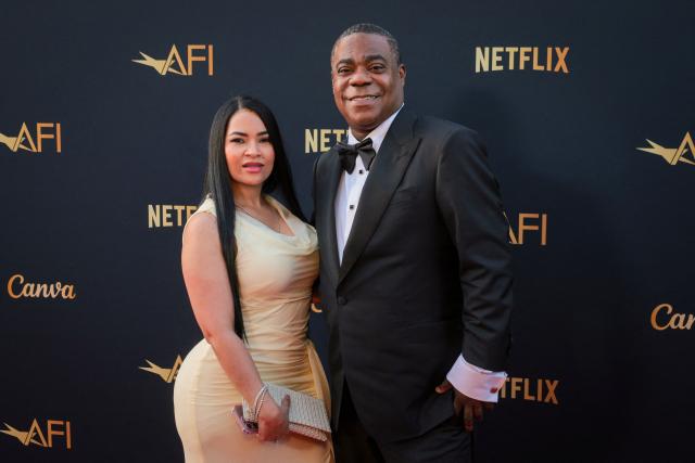 US actor and comedian Tracy Morgan (R) and Helen Hernandez attend the 2026 AFI Life Achievement Award at the Dolby Theatre in Hollywood, California on April 18, 2026. US actor Eddie Murphy is the recipient of the 2026 AFI Life Achievement Award. (Photo by ETIENNE LAURENT / AFP)