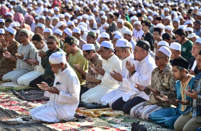 Thai muslims gather to offer prayers a few weeks after an attack tageting Kamolsak Leewamoh, a member of parliament from the Prachachat Party, in the southern Thai province of Narathiwat on April 19, 2026. (Photo by Madaree TOHLALA / AFP)
