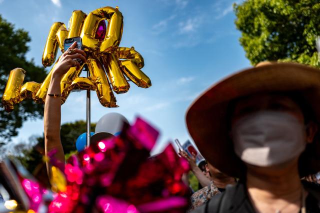 People take part in a "No war! Don’t change the Constitution!" rally outside the main gate of the National Diet Building, to call for the protection of Article 9 of the Constitution of Japan, in Tokyo on April 19, 2026. Article 9 is a clause stipulating that the Japanese people have renounced war as a sovereign right of the nation and the threat or use of force as means of settling international disputes (Photo by Philip FONG / AFP)