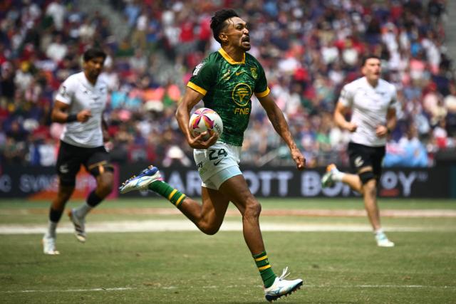 South Africa's Tristan Leyds heads to score a try during the Cup semifinals match between South Africa and New Zealand on the third day of the 2026 Rugby Sevens Hong Kong tournament at Kai Tak Stadium in Hong Kong on April 19, 2026. (Photo by Peter PARKS / AFP)