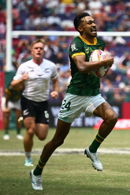 South Africa's Tristan Leyds heads to score a try during the Cup semifinals match between South Africa and New Zealand on the third day of the 2026 Rugby Sevens Hong Kong tournament at Kai Tak Stadium in Hong Kong on April 19, 2026. (Photo by Peter PARKS / AFP)