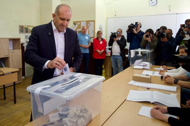 Progressive Bulgaria coalition's leader and former President Rumen Radev casts his ballot at a polling station during Bulgaria's parliamentary elections in Sofia on April 19, 2026. Bulgarians vote in the country's eighth election in five years today, with ex-president Rumen Radev's grouping tipped to win on a pledge to fight corruption, after an anti-graft movement triggered a long political crisis. (Photo by Dimitar KYOSEMARLIEV and Dimitar KYOSEMARLIEV / AFP)
