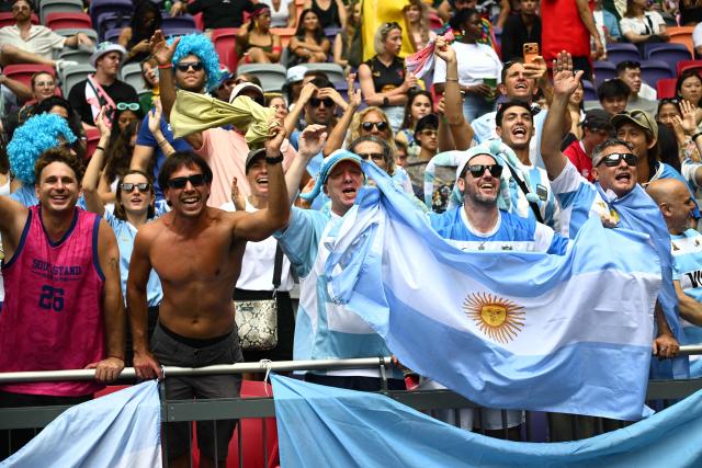 Argentina fans cheer in the stands on the third day of the 2026 Rugby Sevens Hong Kong tournament at Kai Tak Stadium in Hong Kong on April 19, 2026. (Photo by Peter PARKS / AFP)