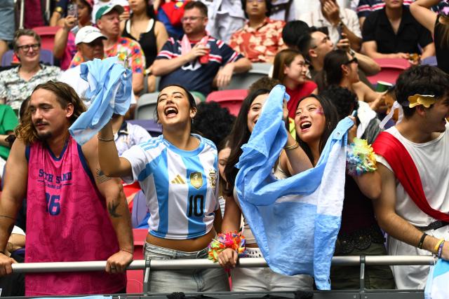 Argentina fans cheer in the stands on the third day of the 2026 Rugby Sevens Hong Kong tournament at Kai Tak Stadium in Hong Kong on April 19, 2026. (Photo by Peter PARKS / AFP)