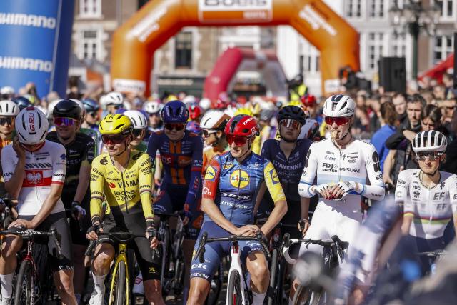Riders pose on the departure line ahead of the start of the 2026 Amstel Gold Race in Maastricht on April 19, 2026. (Photo by Marcel VAN HOORN / ANP / AFP) / Netherlands OUT