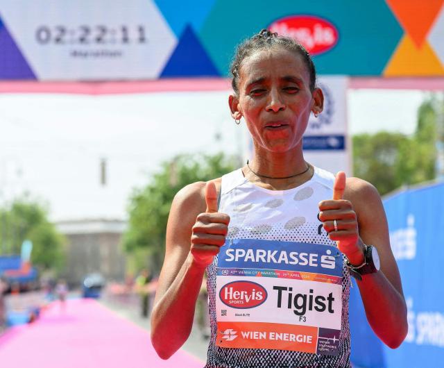 Ethiopia's Tigist Gezahagn reacts after crossing the finish line to win the women's race of the Vienna City Marathon (VCM) in Vienna, Austria, on April 19, 2026. (Photo by MAX SLOVENCIK / APA / AFP) / Austria OUT