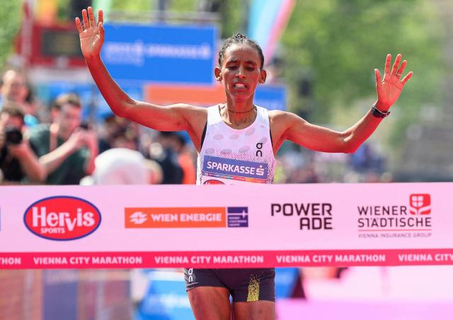 Ethiopia's Tigist Gezahagn crosses the finish line to win the women's race of the Vienna City Marathon (VCM) in Vienna, Austria, on April 19, 2026. (Photo by MAX SLOVENCIK / APA / AFP) / Austria OUT