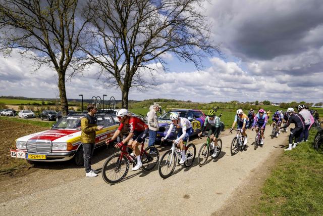 (From L) Lotto Intermarche's Dutch rider Huub Artz, and TotalEnergies French rider Valentin Retailleau cycle ahead of the pack of riders (peloton) during the 2026 Amstel Gold Race in Maastricht on April 19, 2026. (Photo by Marcel VAN HOORN / ANP / AFP) / Netherlands OUT