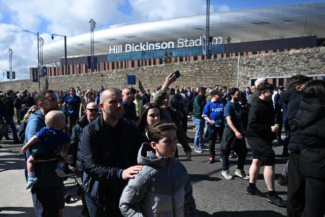 Fans arrive for the English Premier League football match between Everton and Liverpool at Hill Dickinson Stadium in Liverpool, north west England on April 19, 2026. (Photo by Paul ELLIS / AFP)