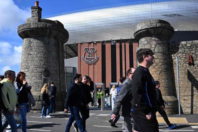 Fans arrive for the English Premier League football match between Everton and Liverpool at Hill Dickinson Stadium in Liverpool, north west England on April 19, 2026. (Photo by Paul ELLIS / AFP)