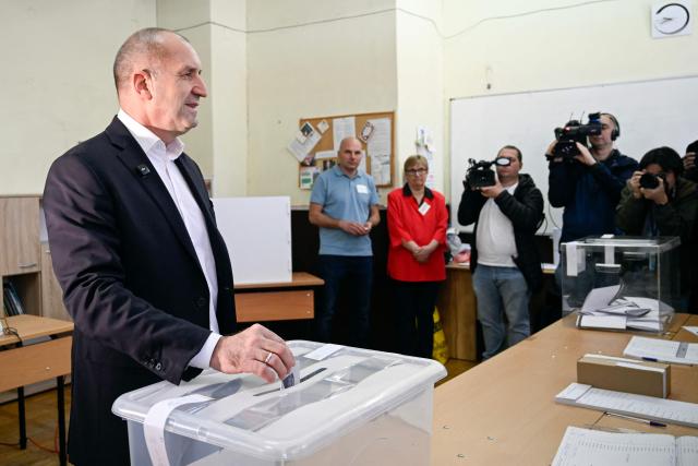 Progressive Bulgaria coalition's leader and former President Rumen Radev casts his ballot at a polling station during Bulgaria's parliamentary elections in Sofia on April 19, 2026. Bulgarians vote in the country's eighth election in five years today, with ex-president Rumen Radev's grouping tipped to win on a pledge to fight corruption, after an anti-graft movement triggered a long political crisis. (Photo by Dimitar KYOSEMARLIEV / AFP)