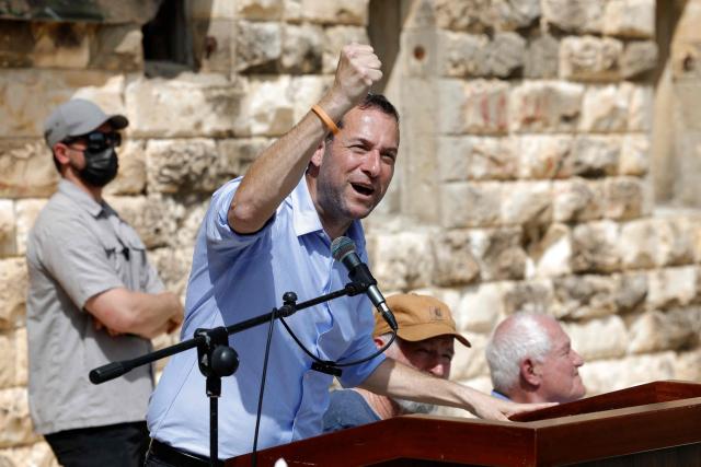 Yossi Dagan, Head of the Shomron Regional Council gestures during the resettlement ceremony of Sa-Nur, south of Jenin, in the Israeli-occupied West Bank on April 19, 2026. Smotrich announced on August 7 plans to rebuild Sa-Nur, a settlement in the occupied West Bank that was evacuated two decades ago, as the far right spearheads a major settlement expansion push. Sa-Nur's settlers were evicted in 2005 as part of Israel's so-called disengagement policy that also saw the country withdrawing troops and settlers from the Gaza Strip. (Photo by Marco Longari / AFP)