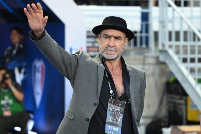OGFC's manager Eric Cantona waves to fans prior to the start of a friendly football match between OGFC, a newly formed football club by Premier League legends from Manchester United, and South Korea's Suwon Samsung Legends in Suwon on April 19, 2026. (Photo by Jung Yeon-je / AFP)