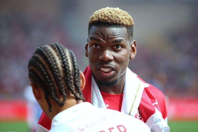 TOPSHOT - Monaco's French midfielder #08 Paul Pogba looks on during the warm-up ahead of the French L1 football match between AS Monaco and AJ Auxerre at the Stade Louis II in the Principality of Monaco on April 19, 2026. (Photo by Valery HACHE / AFP)