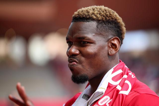 Monaco's French midfielder #08 Paul Pogba looks on during the warm-up ahead of the French L1 football match between AS Monaco and AJ Auxerre at the Stade Louis II in the Principality of Monaco on April 19, 2026. (Photo by Valery HACHE / AFP)