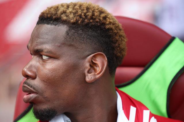 Monaco's French midfielder #08 Paul Pogba looks on during the warm-up ahead of the French L1 football match between AS Monaco and AJ Auxerre at the Stade Louis II in the Principality of Monaco on April 19, 2026. (Photo by Valery HACHE / AFP)