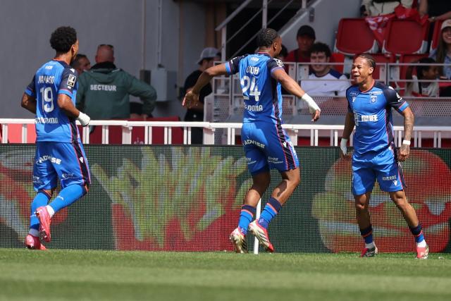 Auxerre's French midfielder #05 Kevin Danois (R) celebrates after scoring his team's first goal during the French L1 football match between AS Monaco and AJ Auxerre at the Louis II Stadium (Stade Louis II) in the Principality of Monaco on April 19, 2026. (Photo by Valery HACHE / AFP)