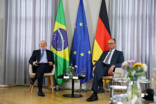 German Chancellor Friedrich Merz (R) and Brazilian President Luiz Inacio Lula da Silva meet for bilateral talks in Hanover, Germany, April 19, 2026. (Photo by Lisi Niesner / POOL / AFP)
