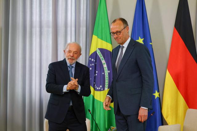 German Chancellor Friedrich Merz (R) and Brazilian President Luiz Inacio Lula da Silva meet for bilateral talks in Hanover, Germany, April 19, 2026. (Photo by Lisi Niesner / POOL / AFP)