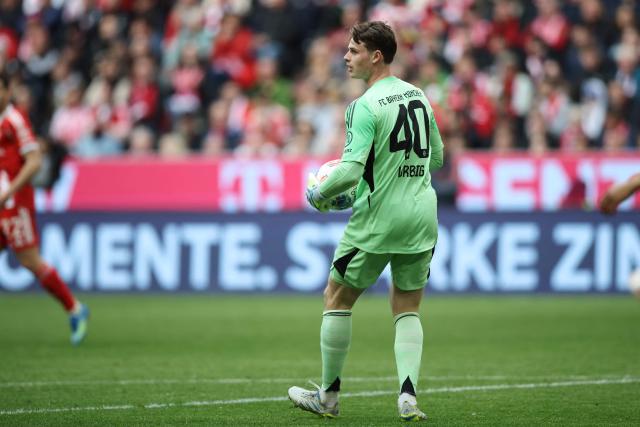 Bayern Munich's German goalkeeper #40 Jonas Urbig reacts during the German first division Bundesliga football match between FC Bayern Munich and VfB Stuttgart in Munich, southern Germany, on April 19, 2026. (Photo by Alexandra BEIER / AFP) / DFL REGULATIONS PROHIBIT ANY USE OF PHOTOGRAPHS AS IMAGE SEQUENCES AND/OR QUASI-VIDEO