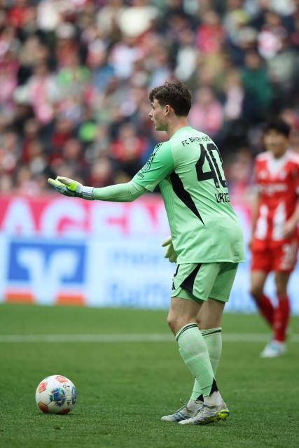 Bayern Munich's German goalkeeper #40 Jonas Urbig reacts during the German first division Bundesliga football match between FC Bayern Munich and VfB Stuttgart in Munich, southern Germany, on April 19, 2026. (Photo by Alexandra BEIER / AFP) / DFL REGULATIONS PROHIBIT ANY USE OF PHOTOGRAPHS AS IMAGE SEQUENCES AND/OR QUASI-VIDEO