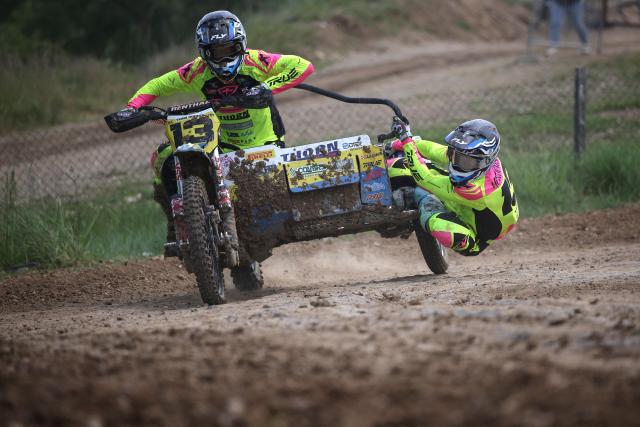 British bikers Michael Hodges and Ryan Henderson ride a sidecar motorcycle as they compete in the first of twelve rounds of the Fim Sidecarcross World Championship in Castelnau-de-Levis, south-western France on April 19, 2026. (Photo by Valentine CHAPUIS / AFP)