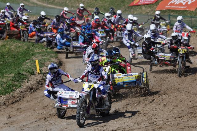 French bikers Kilian Prunier and Evan Prunier (Bottom) ride a sidecar motorcycle as they compete in the first of twelve rounds of the Fim Sidecarcross World Championship in Castelnau-de-Levis, south-western France on April 19, 2026. (Photo by Valentine CHAPUIS / AFP)