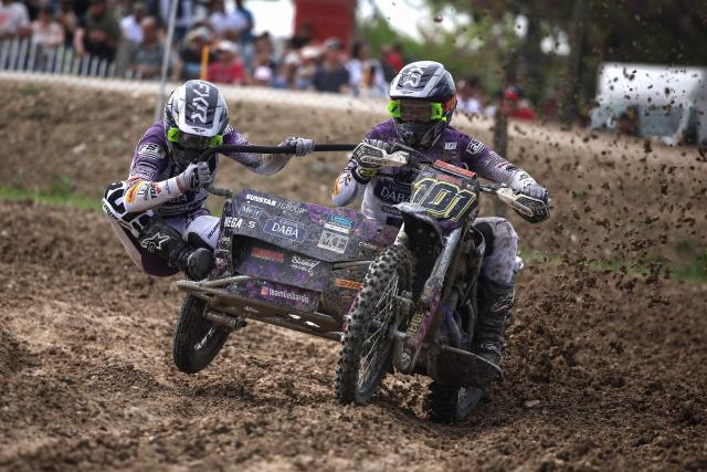Latvian bikers Daniels Lielbardis and Bruno Lielbardis ride a sidecar motorcycle as they compete in the first of twelve rounds of the Fim Sidecarcross World Championship in Castelnau-de-Levis, south-western France on April 19, 2026. (Photo by Valentine CHAPUIS / AFP)