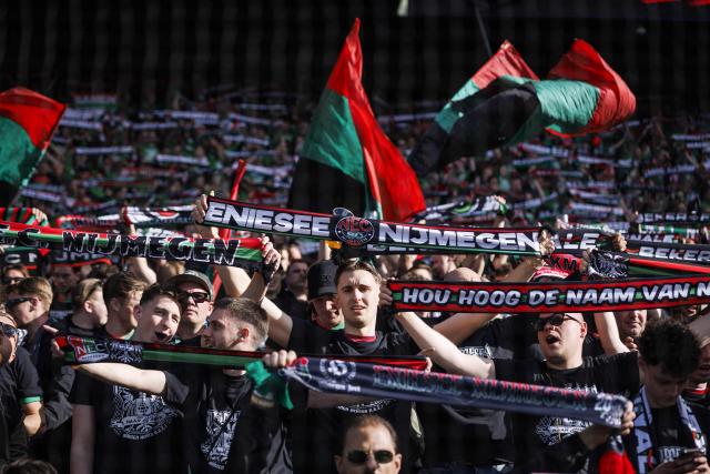 NEC Nijmegen supporters hold flags and club scarves prior to the KNVB Cup final match between AZ Alkmaar and NEC at De Kuip Stadium in Rotterdam, the Netherlands on April 19, 2026. (Photo by Robin van Lonkhuijsen / ANP / AFP) / Netherlands OUT