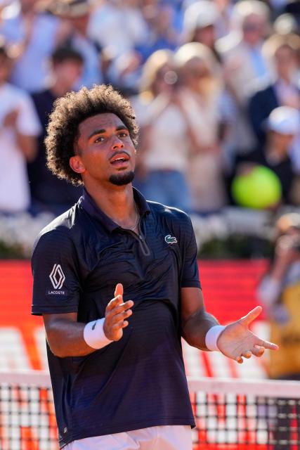 France's Arthur Fils celebrates winning the men’s singles final match against Russia's Andrey Rublev at the ATP Barcelona Open "Conde de Godo" tennis tournament in Barcelona, on April 19, 2026. Fils won 6-2, 7-6 (7/2) (Photo by Manaure Quintero / AFP)