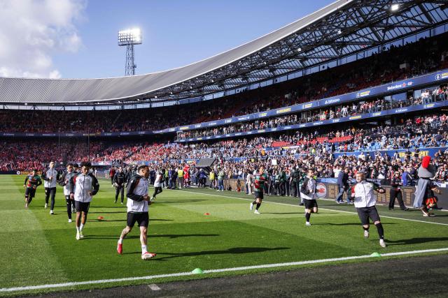 NEC Nijmegen players warm up on the pitch prior to the KNVB Cup final match between AZ Alkmaar and NEC at De Kuip Stadium in Rotterdam, the Netherlands on April 19, 2026. (Photo by Robin van Lonkhuijsen / ANP / AFP) / Netherlands OUT