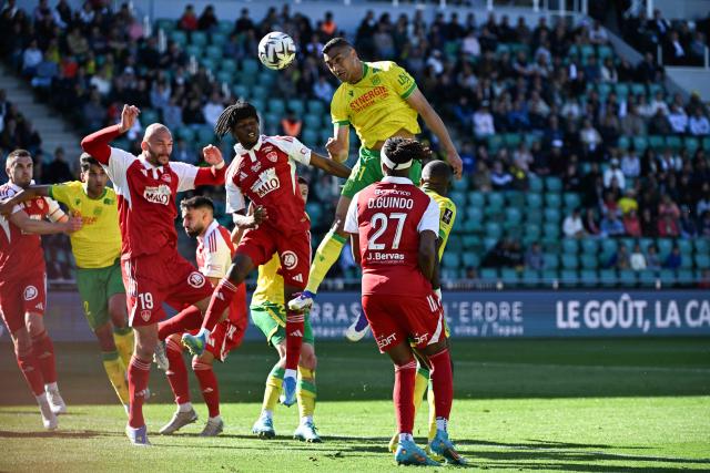 Nantes' Egyptian forward #31 Mostafa Mohamed goes for a header during the French L1 football match between FC Nantes and Stade Brestois at the Stade de la Beaujoire–Louis Fonteneau in Nantes, western France, on April 19, 2026. (Photo by Sebastien Salom-Gomis / AFP)