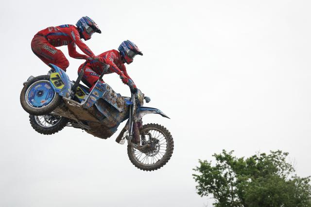 Dutch bikers Tim Leferink and Sem Leferink ride a sidecar motorcycle as they compete in the first of twelve rounds of the FIM SideCarCross World Championship in Castelnau-de-Levis, south-western France on April 19, 2026. (Photo by Valentine CHAPUIS / AFP)