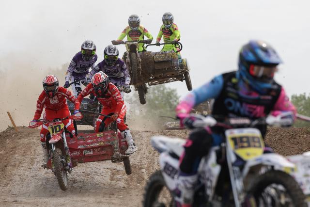 Bikers ride sidecar motorcycles as they compete in the first of twelve rounds of the FIM SideCarCross World Championship in Castelnau-de-Levis, south-western France on April 19, 2026. (Photo by Valentine CHAPUIS / AFP)
