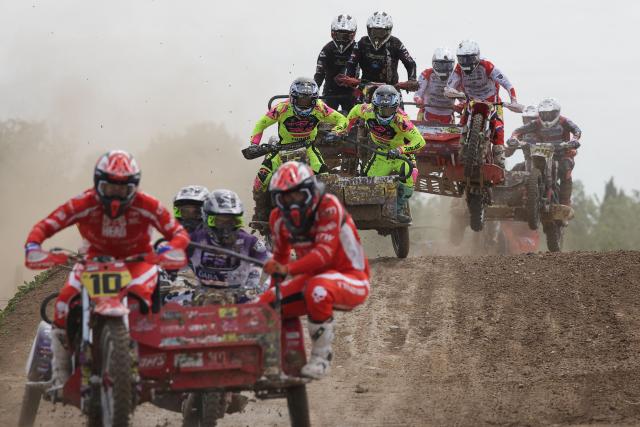 Bikers ride sidecar motorcycles as they compete in the first of twelve rounds of the FIM SideCarCross World Championship in Castelnau-de-Levis, south-western France on April 19, 2026. (Photo by Valentine CHAPUIS / AFP)