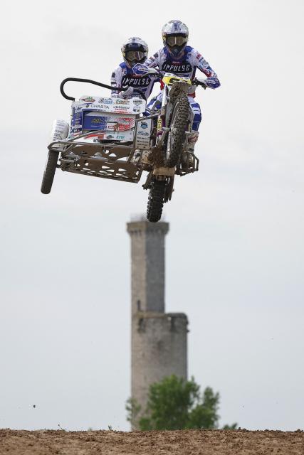 French bikers Kilian Prunier and Evan Prunier ride a sidecar motorcycle as they compete in the first of twelve rounds of the FIM SideCarCross World Championship in Castelnau-de-Levis, south-western France on April 19, 2026. (Photo by Valentine CHAPUIS / AFP)