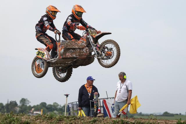 French bikers Ethan Poirier and Matthias Poirier ride a sidecar motorcycle as they compete in the first of twelve rounds of the FIM SideCarCross World Championship in Castelnau-de-Levis, south-western France on April 19, 2026. (Photo by Valentine CHAPUIS / AFP)