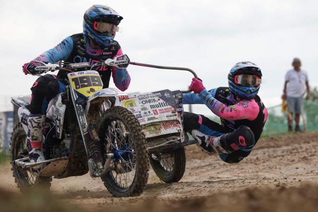 British bikers Brett Wilkinson and Joe Millard ride a sidecar motorcycle as they compete in the first of twelve rounds of the FIM SideCarCross World Championship in Castelnau-de-Levis, south-western France on April 19, 2026. (Photo by Valentine CHAPUIS / AFP)