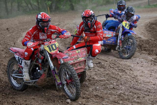 German bikers Dan Foden and Noah Weinmann ride a sidecar motorcycle as they compete in the first of twelve rounds of the FIM SideCarCross World Championship in Castelnau-de-Levis, south-western France on April 19, 2026. (Photo by Valentine CHAPUIS / AFP)