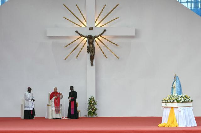 Pope Leo XIV (2nd L) leads a Holy Rosary Prayer on the esplanade in front of the "Mama Muxima" Shrine in Muxima on the seventh day of an 11-day apostolic journey to Africa, on April 19, 2026. (Photo by Alberto PIZZOLI / AFP)
